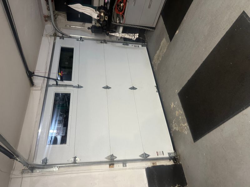 Commercial sectional door with chain hoist opener system interior view